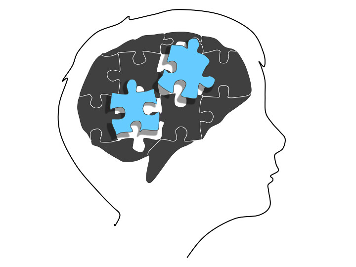 Brain with puzzle pieces.